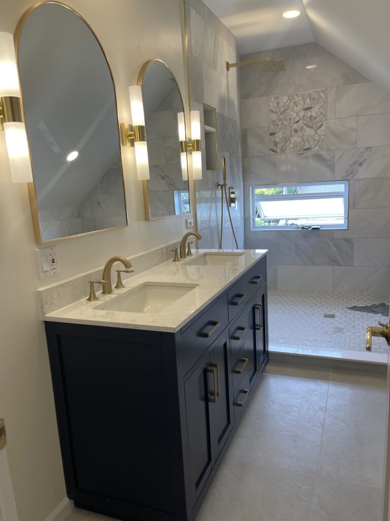Primary bathroom remodel with navy double vanity in Chicago